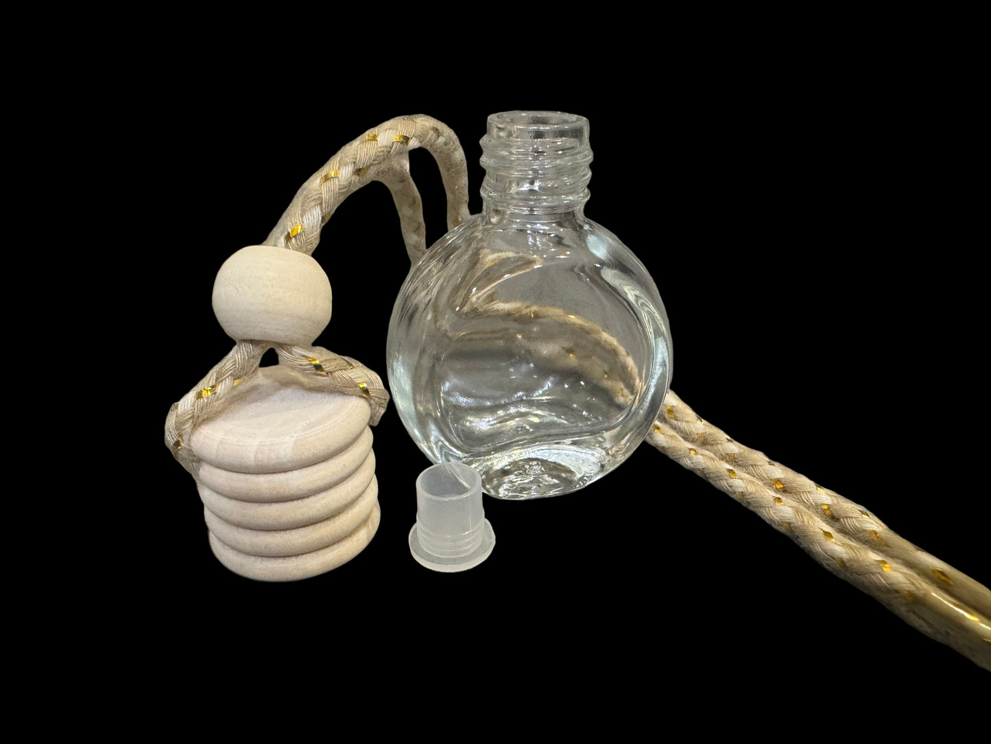 Decorative car air freshener / car diffuser bottle with a white wooden top and rope.