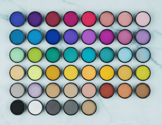 Grid of colorants on a marble background