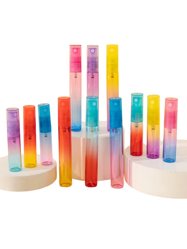 Set of colorful gradient spray bottles on a white background. Buy wholesale perfume bottles online.