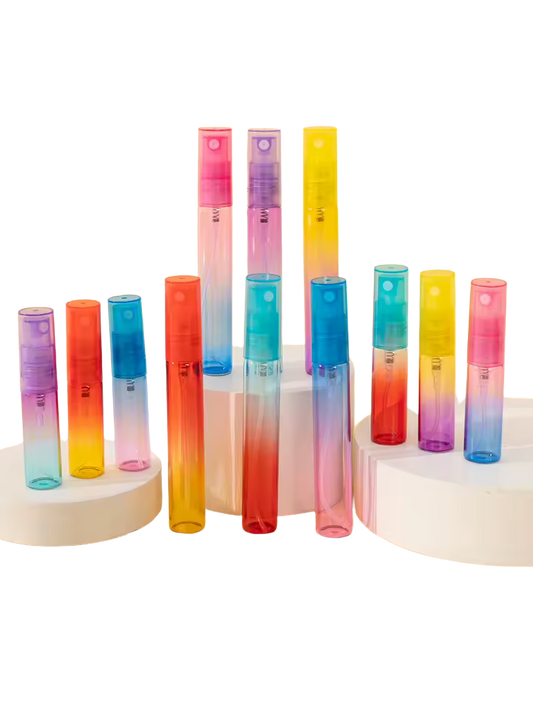 Set of colorful gradient spray bottles on a white background. Buy wholesale perfume bottles online.