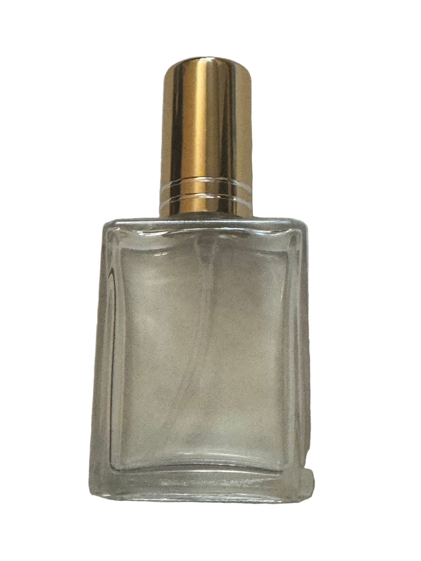 Travel size wholesale perfume and cologne bottle. Clear glass bottle with gold cap on a white background.